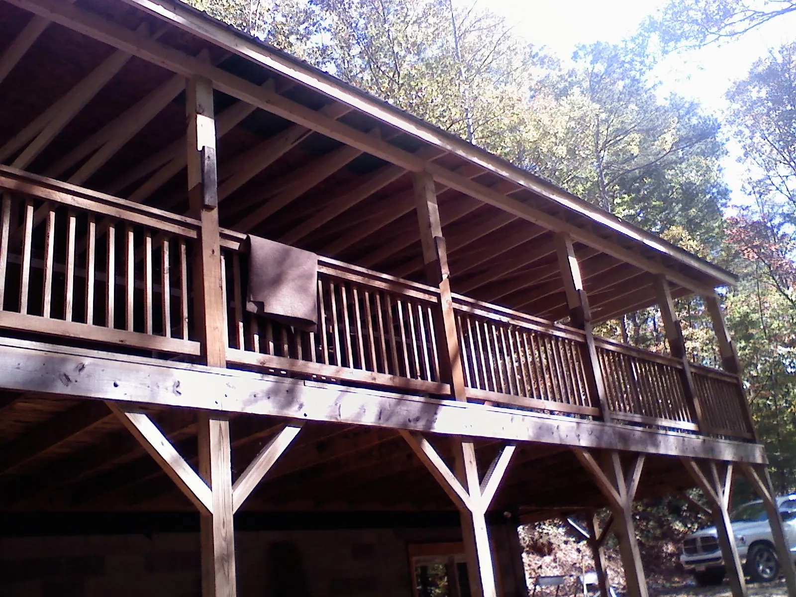 Timber framing under a new elevated porch and deck — Roof Leak Repair in Max by Roofing Brothers